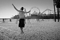 Man on tightrope Santa Monica California